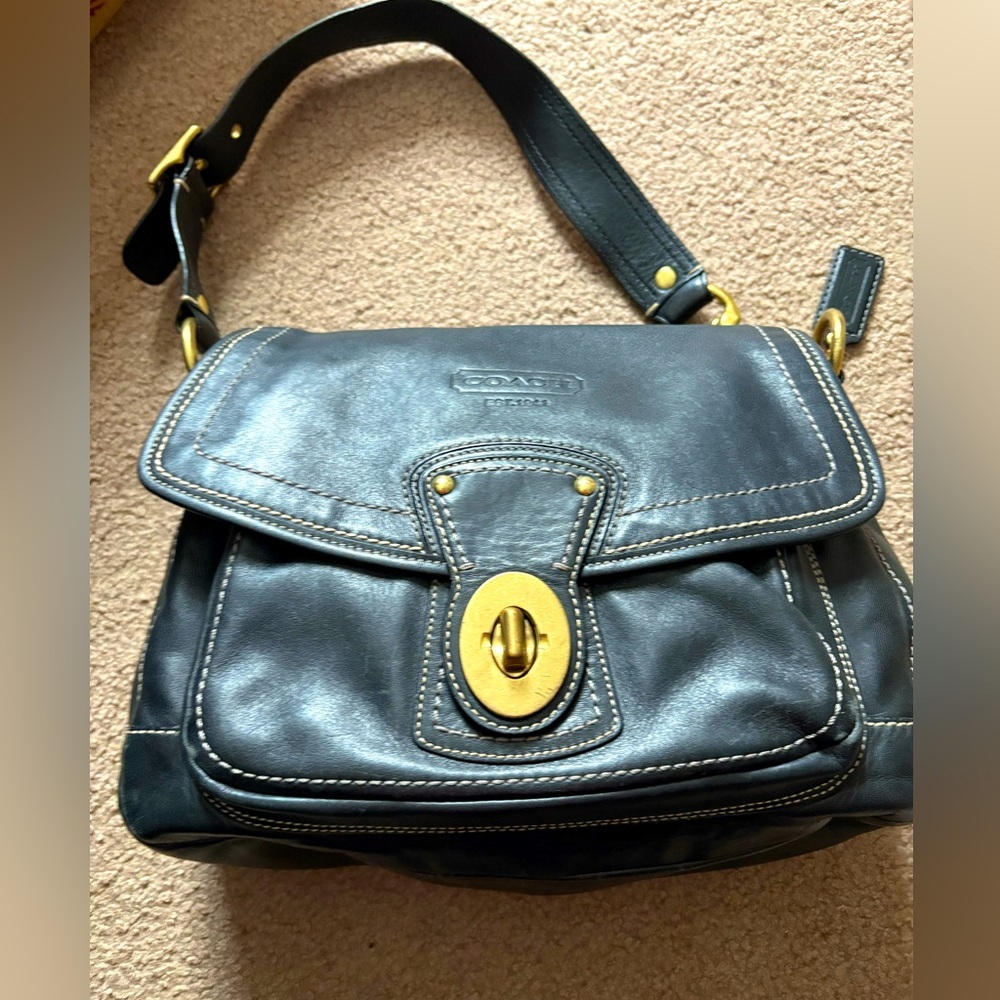 Black all leather coach saddlebag purse with gold hardware and pink interior